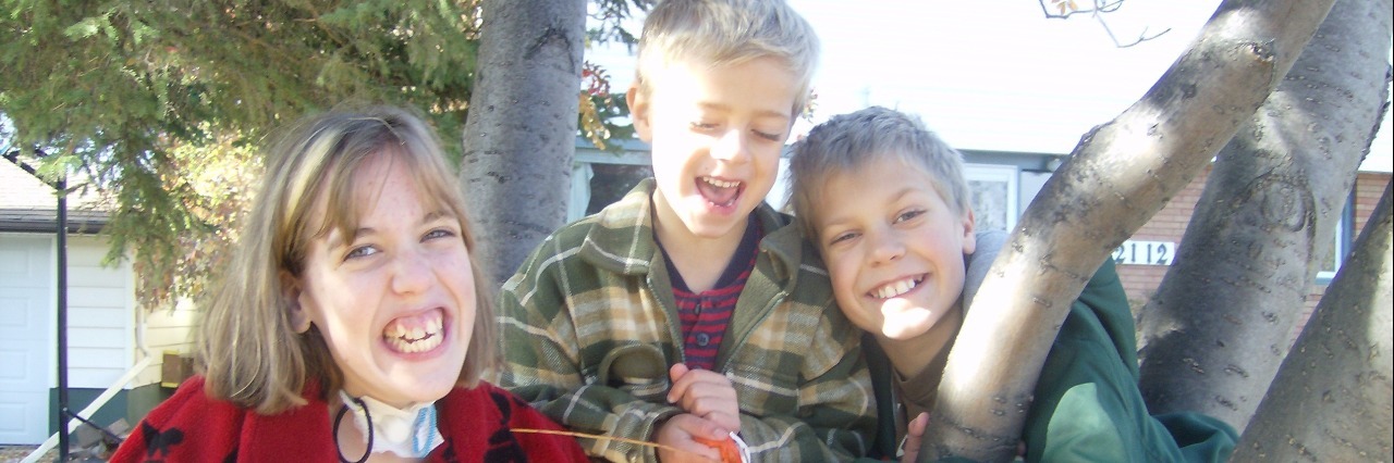 What It Feels Like to Have a Chronically Ill Sibling Mariah and her brothers smiling