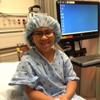 Angela's daughter smiling before surgery