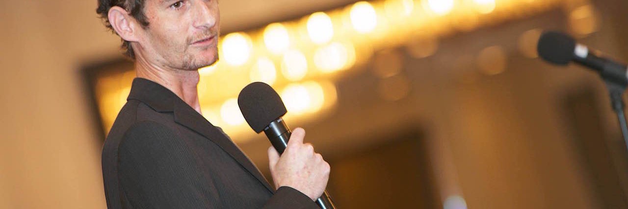 When a Doctor Told Me ‘Helping Others With My Condition Should Be Left to Trained Medical Professionals’ Andy speaking at an SBS conference