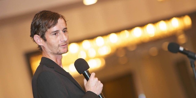 Andy speaking at an SBS conference