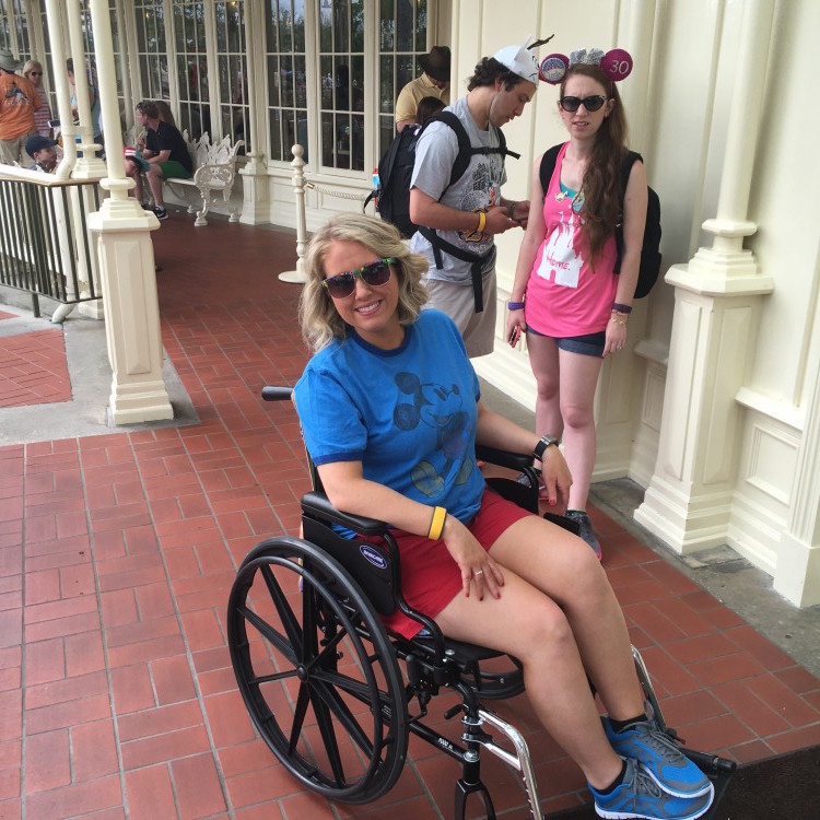 woman sitting in wheelchair at disney world