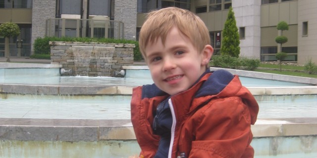 Why I'm Afraid I'll 'Blink' Through My Son's Life With Duchenne Luke smiling holding a teddy bear