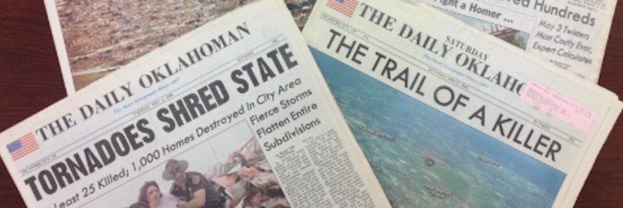 Tornado in Oklahoma: Living With PTSD After a Storm A stack of newspaper cover stories about Oklahoma tornado that hit on May 3, 1999