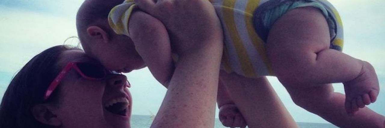 When You Are a Mom Ashamed of Postpartum Depression and Anxiety Mom holds baby son up to her face