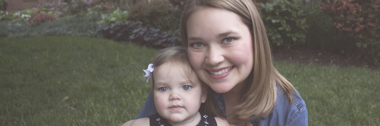 Parenting With Crohn's Disease and Inflammatory Bowel Disease lauren bordeaux and her daughter in a field