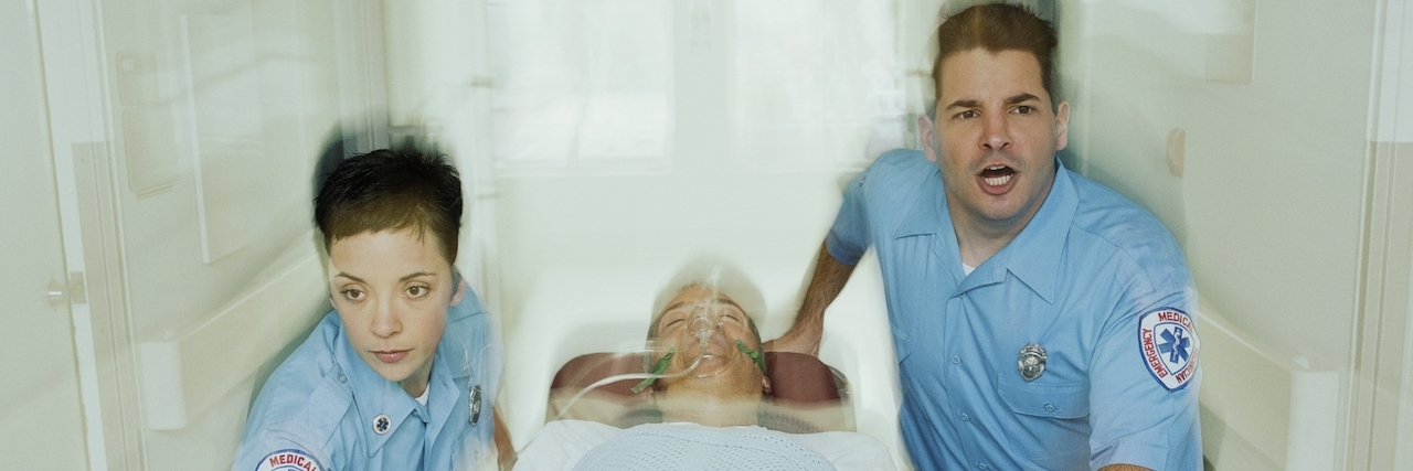 To ER Staff on Their Treatment of People With Mental Illness Emergency medical staff push patient in stretcher