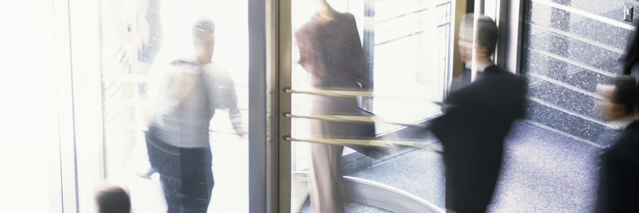 When Bipolar Disorder Makes You Dizzy People walking through a revolving door