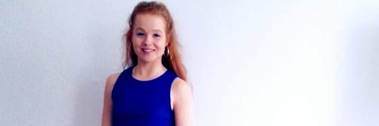 Letter to My Eating Disorder: I'm Tired of You Sarah smiling and wearing a blue dress