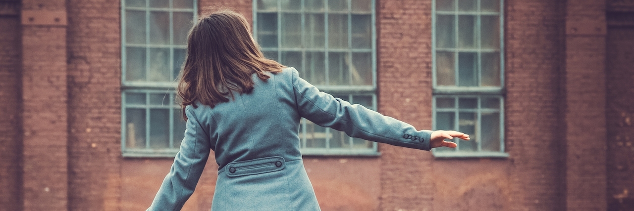 How to Find Balance in the Battle With Bipolar Disorder Girl walking on a railway