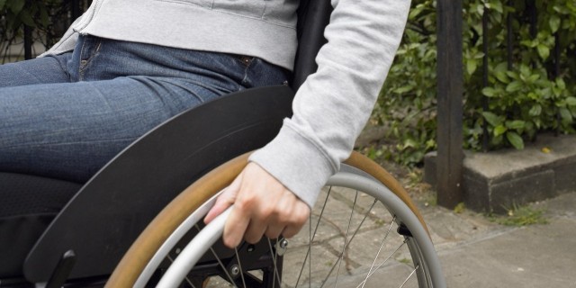 Woman sitting in wheelchair