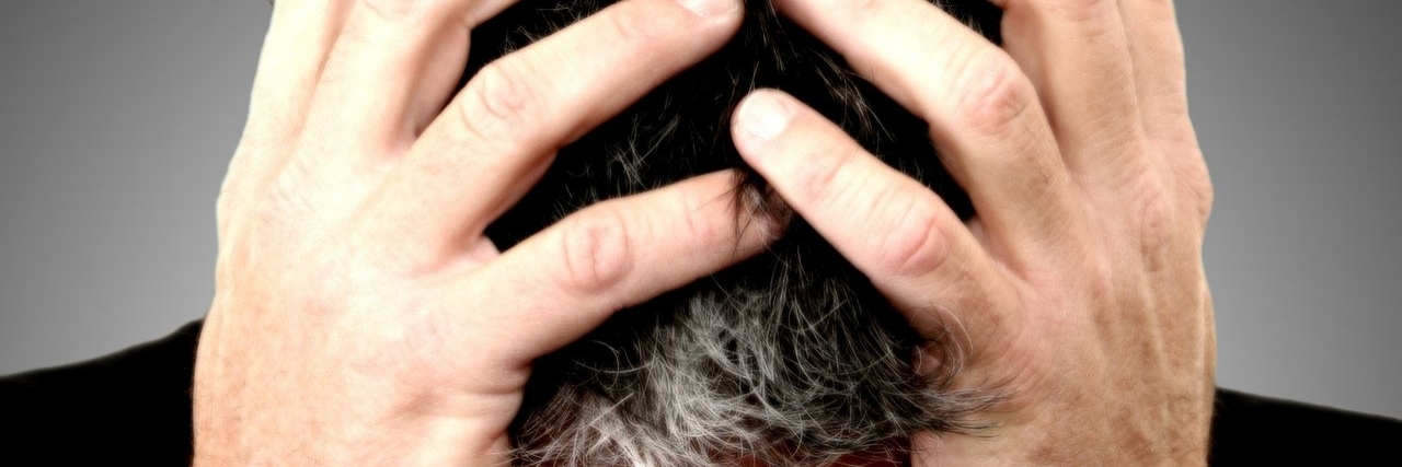 Multiple Sclerosis: Coping With Brain Fog man with hands on his head