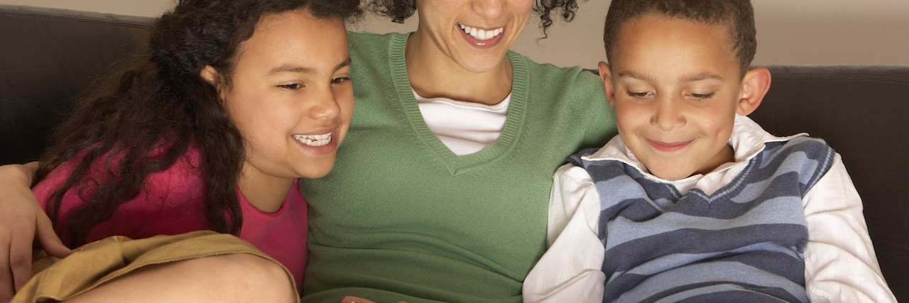 Books to Help Your Child Deal With Anxiety Mom reading books to her two kids