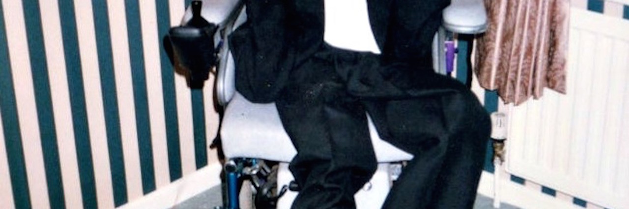 Having a Family History of Duchenne Muscular Dystrophy Claire's brother Mark, smiling in his wheelchair