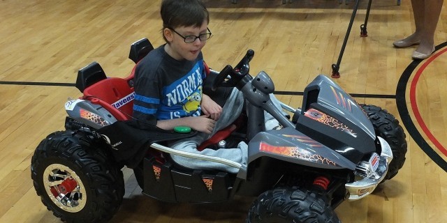 One of B.A. List's Rock Creek students tests out an adapted toy car.