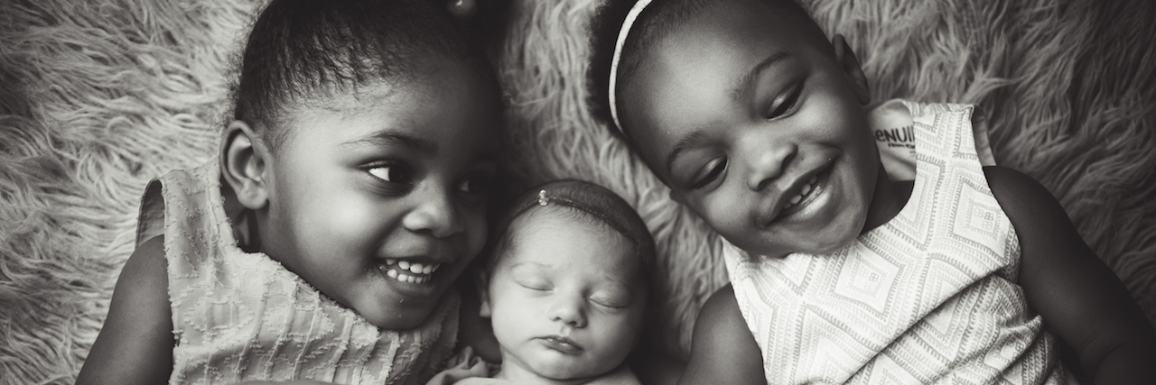 Infertility and Adoption: How We Accepted Not Having Biological Kids three little girls smiling