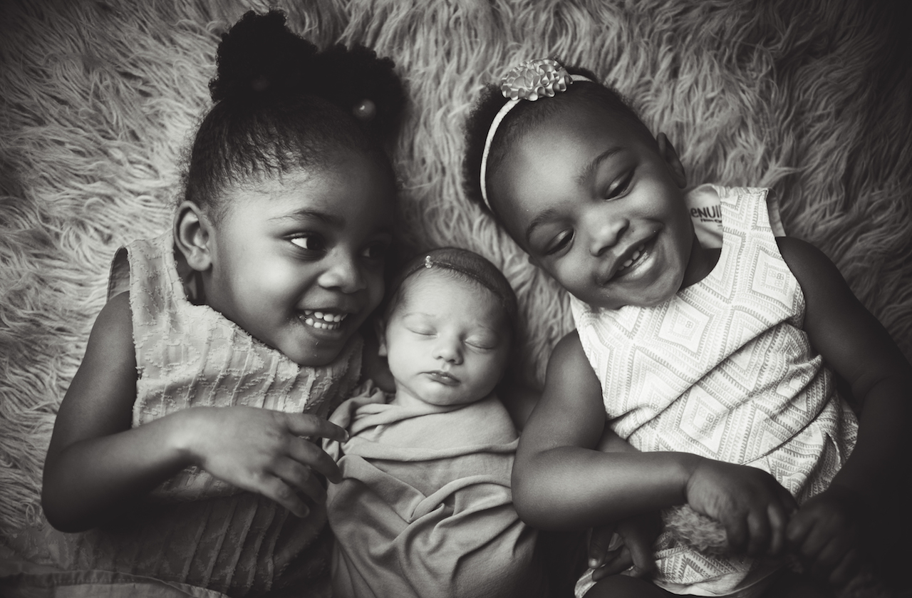 three little girls smiling