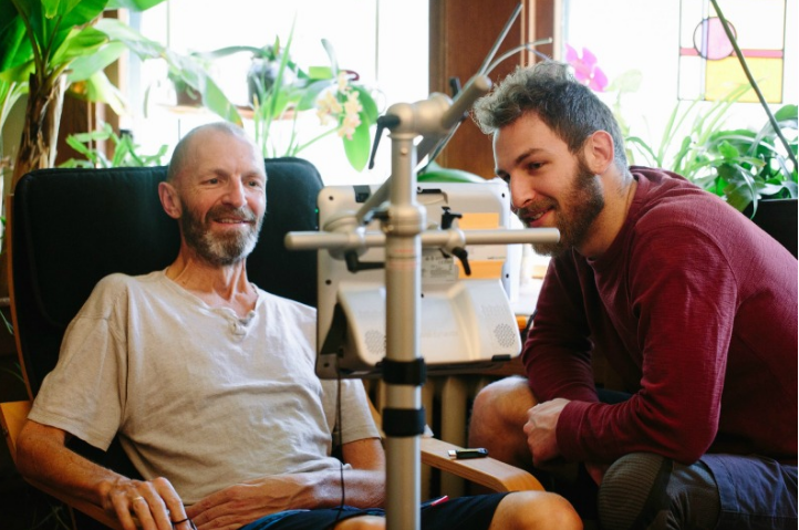 Ray and his son Manu program an eye-gaze computer that will helps Ray communicate. Manu's technological assistance allows him to be a part of Ray's care.