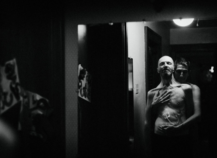 Rae and Ray stand in front of a mirror. Ray calls his reflection a “stranger in the mirror.”