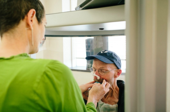 Although he used to be a provider at the hospital, Ray is now a patient at Carle Foundation Hospital in Urbana, IL, where his local MDA Care Center is located. Here he takes a pulmonary function test.