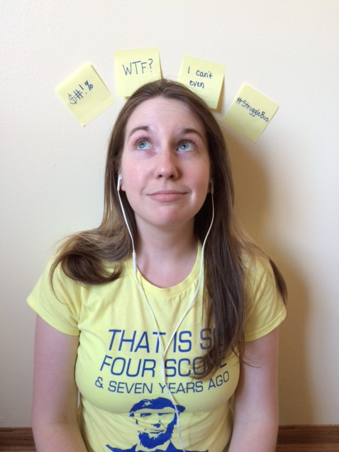 woman standing against wall with post-it notes behind her head