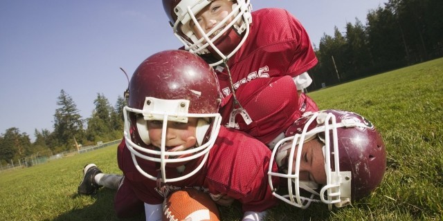 The Day I’ll Have to Tell My Son He Can’t Play Contact Sports Kids playing football