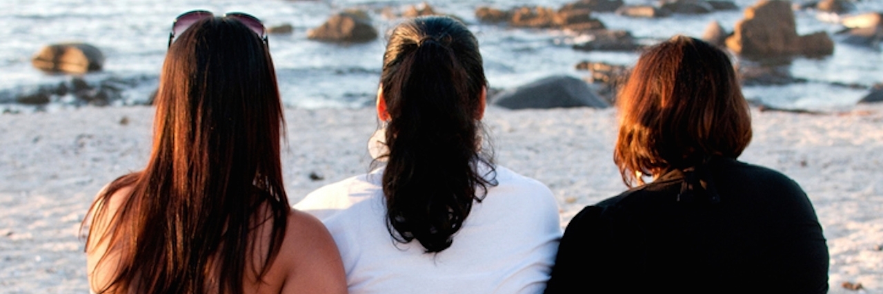 Three women hugging