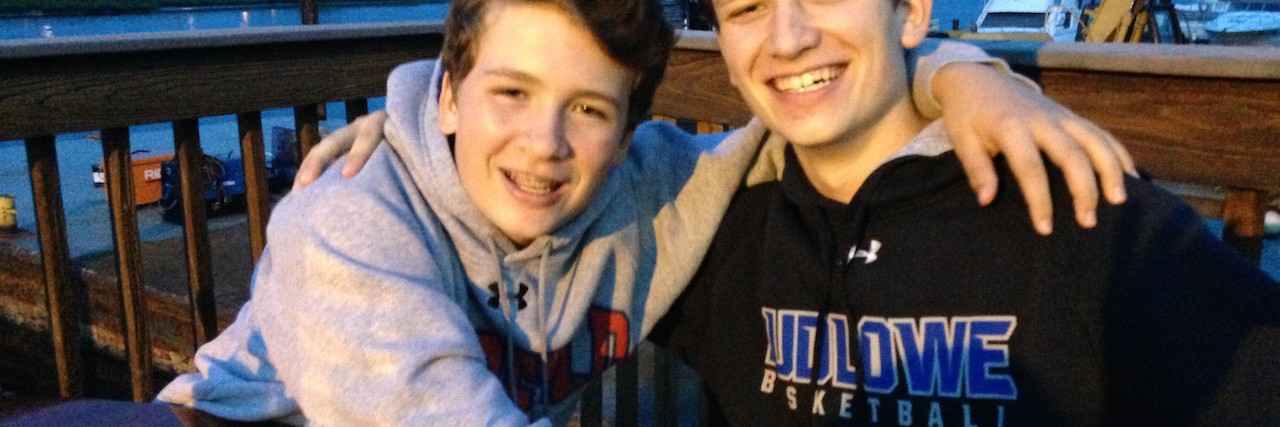 Suicide of a Parents: Effects on Children The author's two sons, sitting outside at night with their arms around each other.