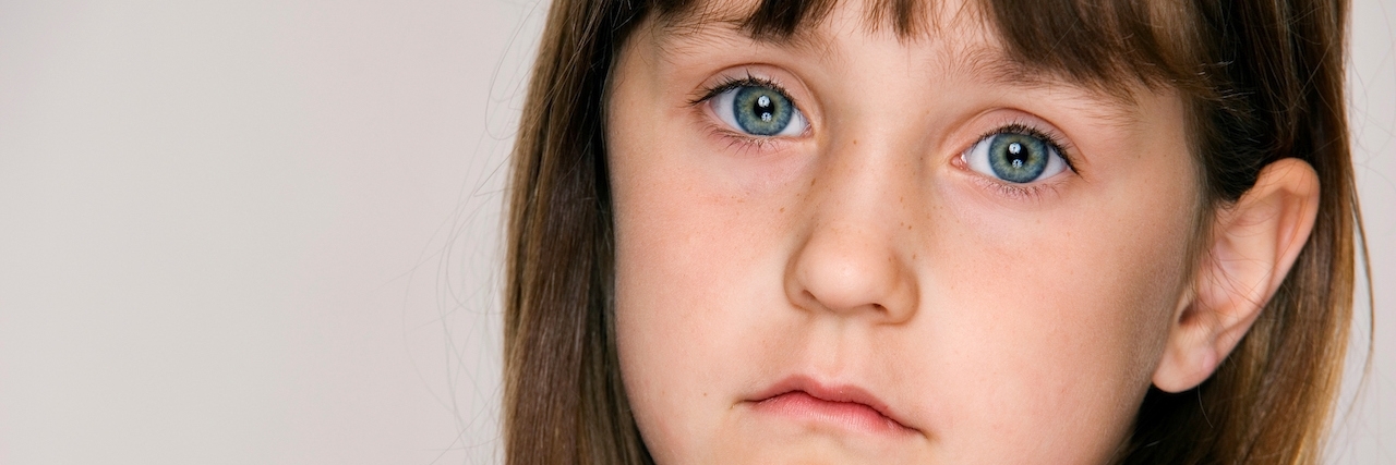 Daughter Hospitalized for Juvenile Bipolar Disorder Sad face of young six year old girl.