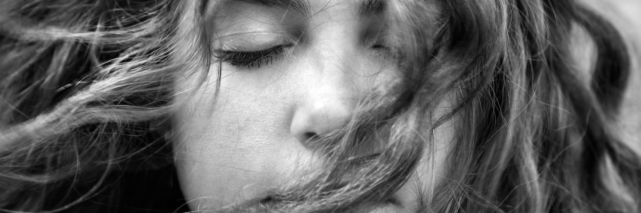 14 Things Parents of Children With Mental Illness Want You to Know young woman with hair blowing in her face