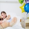 Child hugging a teddy bear in Hospital