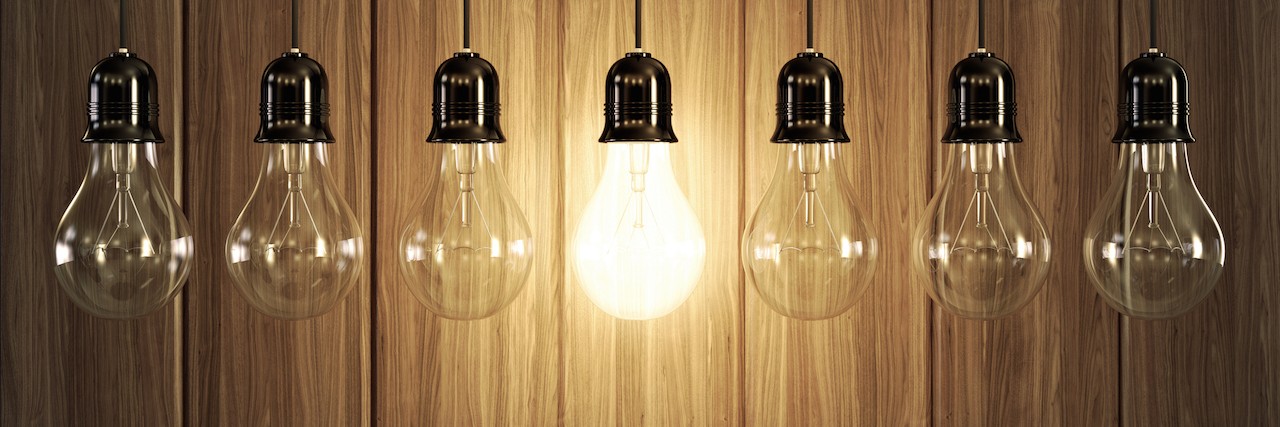 Starting a Foundation for Small Bowel Syndrome Seven light bulbs with glowing one on wooden background.