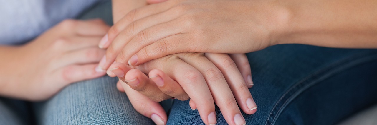 To The Friend Who Didn’t Tell Me About Their Chronic Illness two women friends holding hands