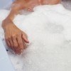 Man lying in bath