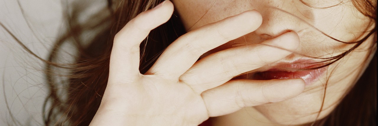 What You Should Know Before You Judge Self-Harm Young woman looking to side, close-up