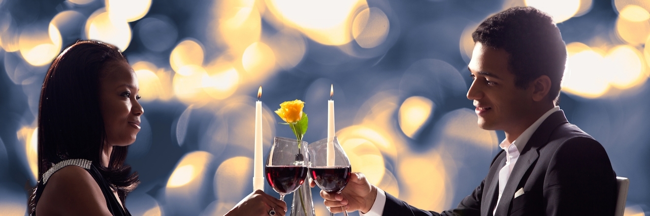 Dating and Depression: What I've Learned So Far Portrait Of Romantic Couple Toasting Red Wine At Dinner