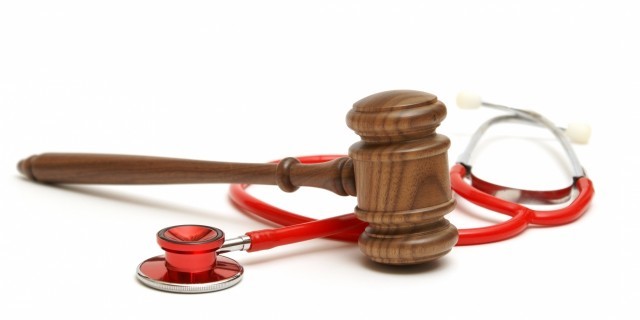 California Becomes Fifth State to Give Terminally Ill Residents the 'Right to Die' Wooden gavel and stethoscope