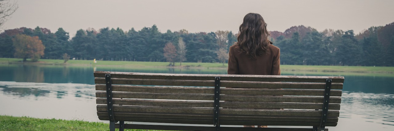 Not Everyone Who Has Anxiety Is Shy, or Afraid of People Young woman sitting on a bench in a city park