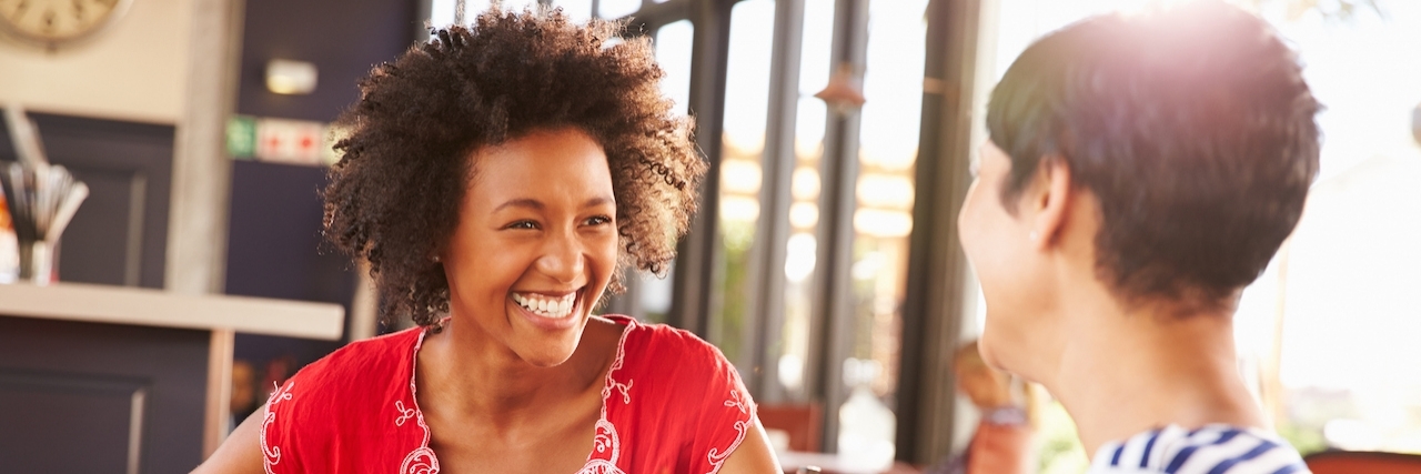 A Letter to Potential Friends From Someone With Chronic Illness Two female friends talking at a coffee shop