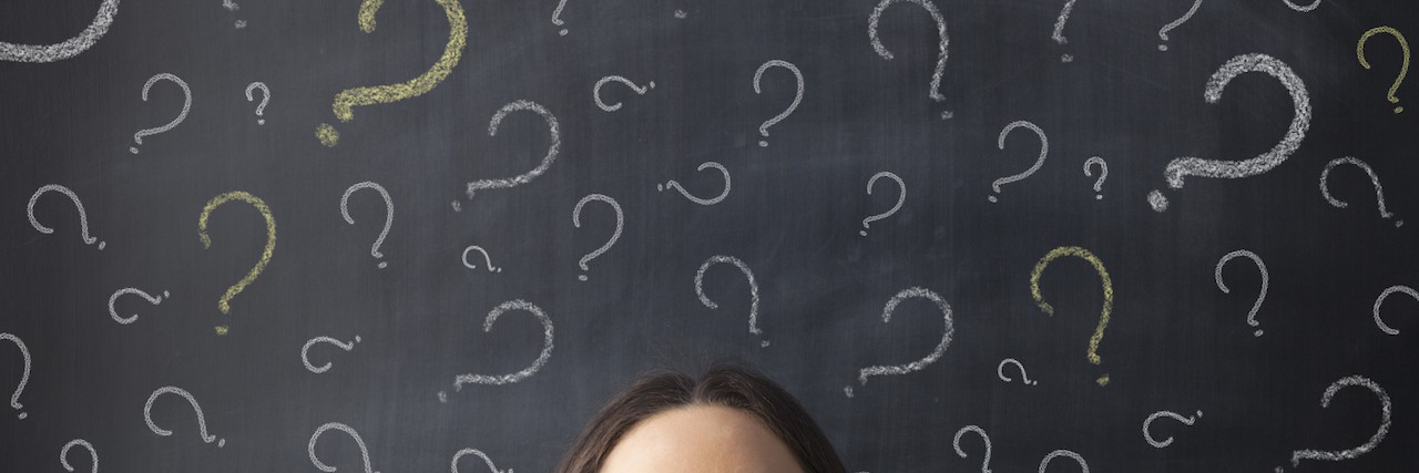How to Answer Difficult Questions With Chronic Pain Chalk question marks above businesswoman at blackboard