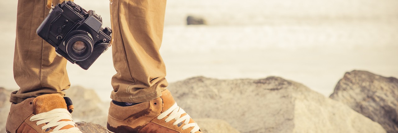 Life Lessons You Learn After a Suicide Attempt Feet man and vintage retro photo camera outdoor