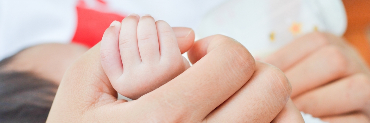 Letter to the Public Health Nurse Who Helped Family With Ehlers-Danlos mother holding foot babymother holding hand baby