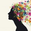 silhouette of woman with colorful birds and flowers coming out of her head