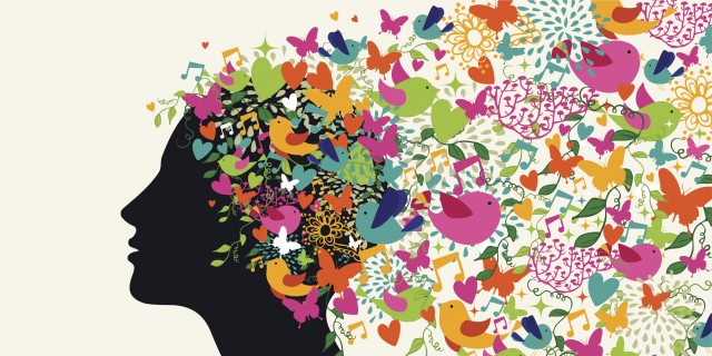 silhouette of woman with colorful birds and flowers coming out of her head