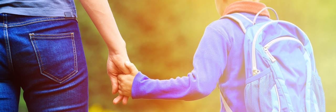 My Child With Narcolepsy: How Parenting Expectations Change Mother holding hand of little son with backpack outdoors, back to school