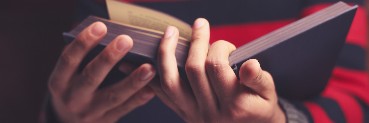 Being Diagnosed With Sarcoidosis: What I've Learned Close-up of a man in a red striped sweater reading a book