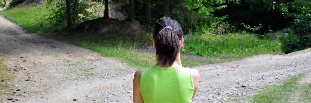 Girl with a choice near the forked road