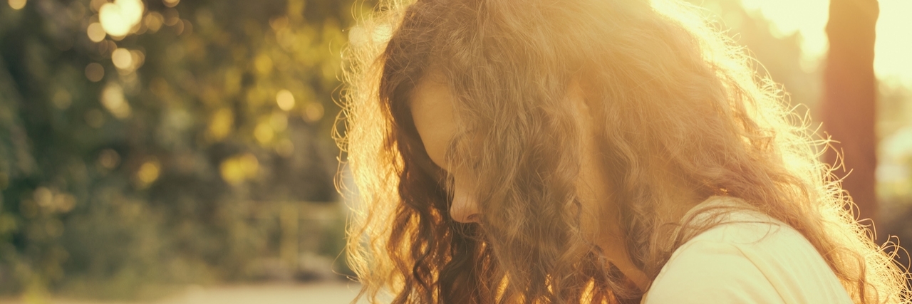 Coping With Chronic Pain and Erythromelalgia Portrait of a young woman in sunlight