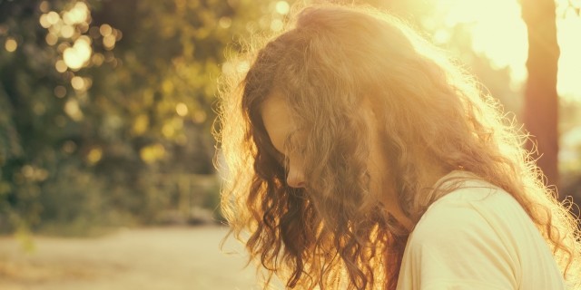 Portrait of a young woman in sunlight