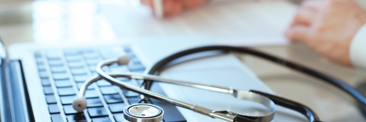 To Doctor Who Didn't Think I Understood POTS doctor writing with computer and stethescope in the foreground