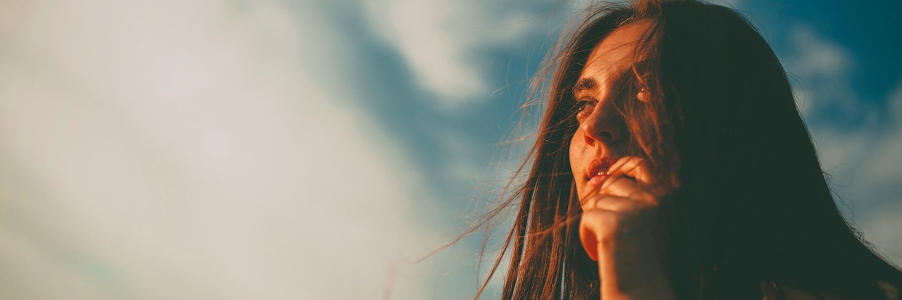 Signs That You're Recovering From Depression girl outside in a field